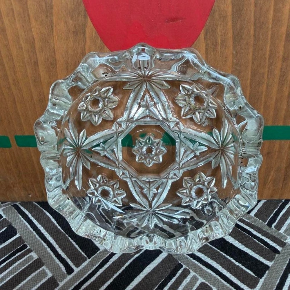 Clear glass ashtray with floral design